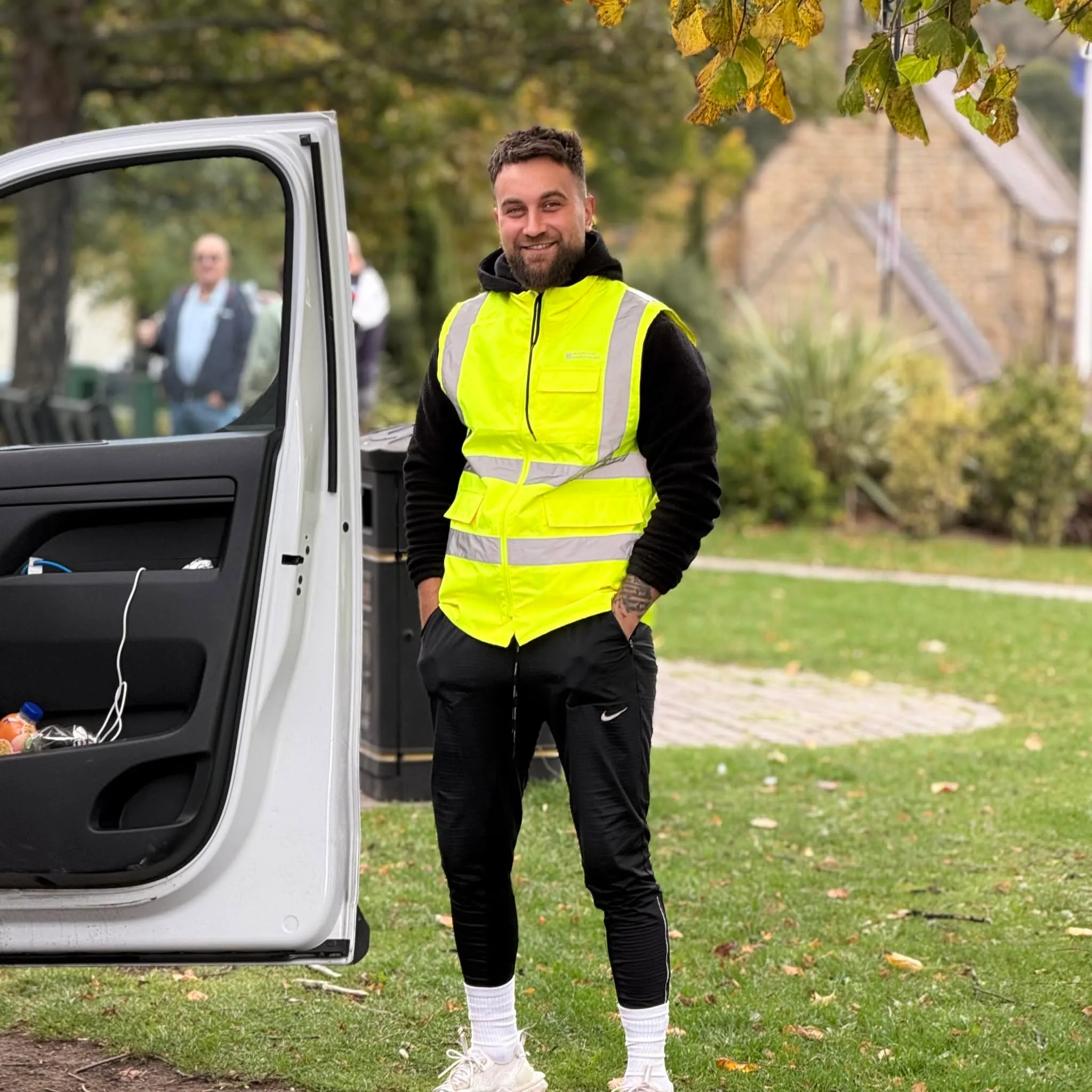 Angel, who runs Angels Property Repairs, standing beside his work van
